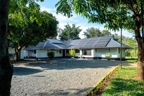 a house with solar panels on the roof at Harry's Kisumu Oasis in Kisumu