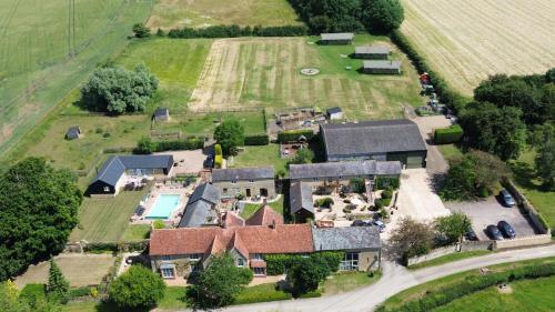 an aerial view of a house with a yard at Upper Dovehouse in Warrington