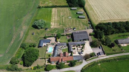 an aerial view of a house with a yard at Upper Dovehouse in Warrington