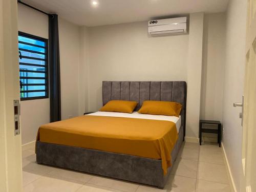 Postel nebo postele na pokoji v ubytování MGM Apartments Paramaribo