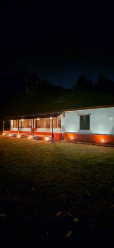 a building with lights in front of it at night at Taramrata homestay Gokarna in Gokarna