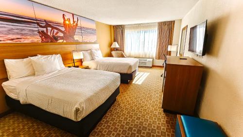 Ένα ή περισσότερα κρεβάτια σε δωμάτιο στο Days Inn by Wyndham Sherman