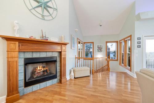 a living room with a fireplace in a house at Sea of Cedar Key in Cedar Key
