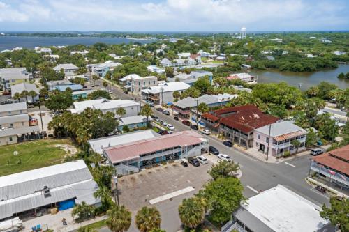 an aerial view of a town with a river at Sea of Cedar Key in Cedar Key