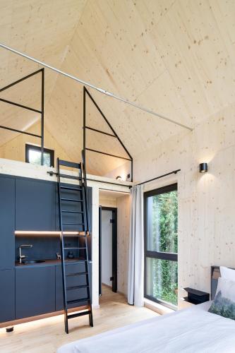 Ein Bett oder Betten in einem Zimmer der Unterkunft 1Step2AllStars Baumhaus