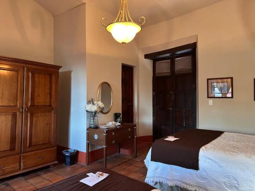 Una cama o camas en una habitación de Santa Elena Hotel Boutique