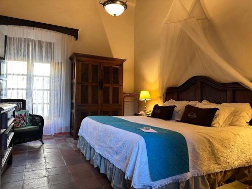 Una cama o camas en una habitación de Santa Elena Hotel Boutique