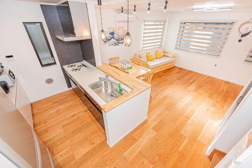 a kitchen with a sink and a counter top at Arashi hotel 嵐ホテル in Tokyo