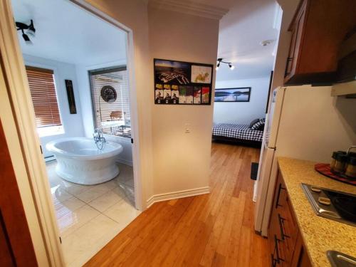 a kitchen with a bathroom with a tub in a room at Studio Rustico Chic Nearby Piedmonts Hotspots in Piedmont