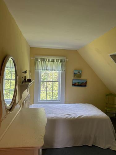 a bedroom with a bed and a window at Loringwood Acres in Perry in Perry