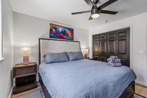 a bedroom with a large bed and a ceiling fan at Decorated for the Holidays! 2BDR Home in Downtown Flagstaff in Flagstaff