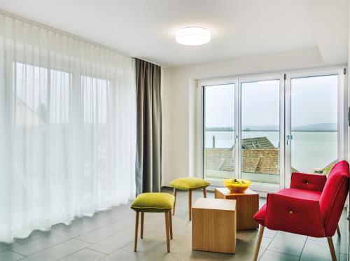 a living room with a view of the ocean at Ferienhotel Bodensee in Berlingen