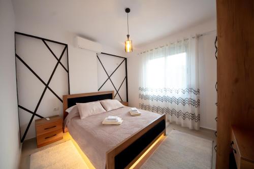 Postel nebo postele na pokoji v ubytování Aila Apartament