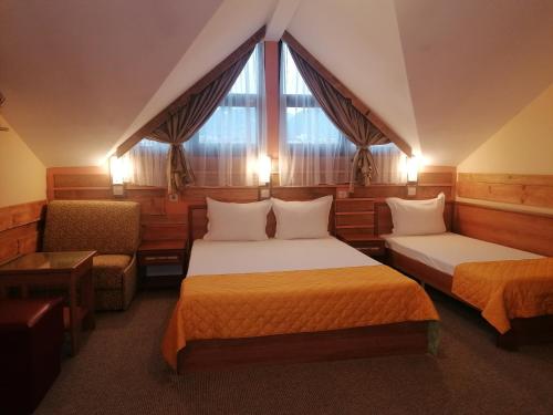 Postel nebo postele na pokoji v ubytování Boutique Guest House IKONOMOV