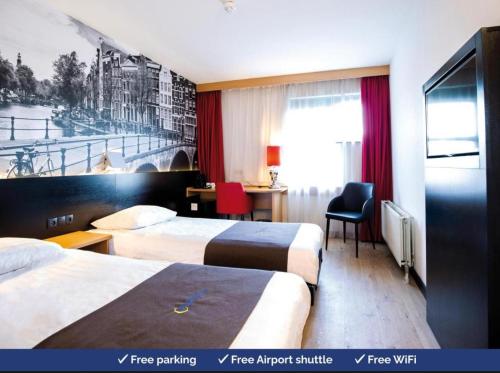 a hotel room with two beds and a desk at Airport INN Hotel in Lomé