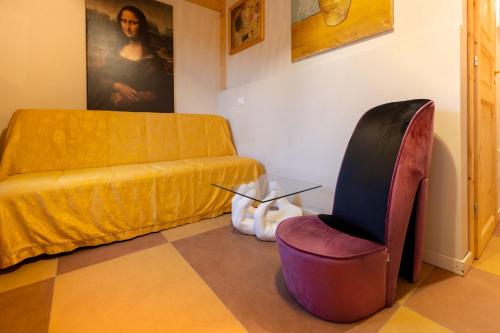 a living room with a couch and a chair at Camping Camplani in Zone