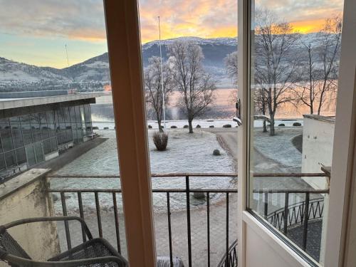 a view from the balcony of a condo with snow on the ground at Park Hotel Vossevangen in Vossevangen