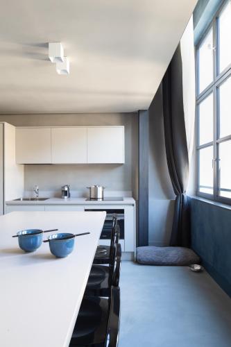 a kitchen with two bowls on a counter at EDIT Lofts in Turin