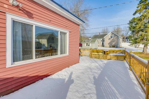 a house with a large window on the side of it at Close to Dtwn Bangor Inviting Maine Home in Veazie