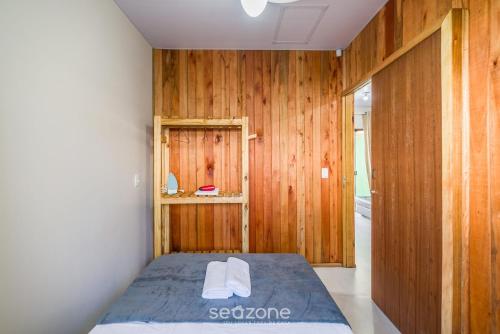 En eller flere senge i et værelse på RUC - Casas a 270m da Praia do Canto Grande