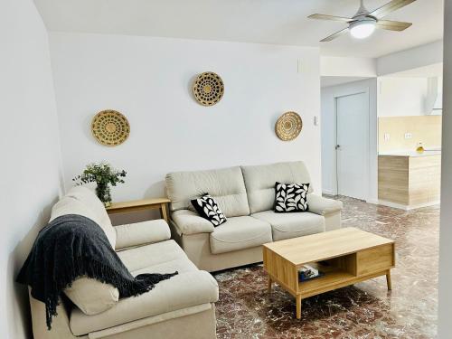 a living room with a couch and a table at La Roca in Losa del Obispo