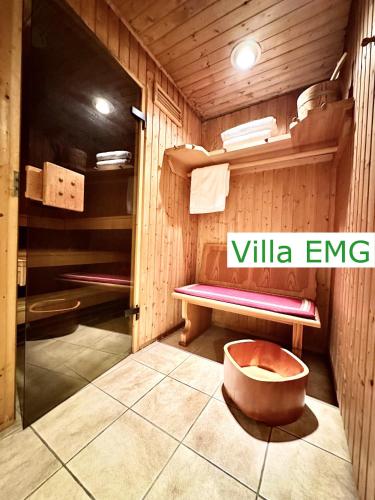 a sauna with a bench and a tub in it at Luxury Spa Villa EMG Karlsruhe Baden-Baden Rastatt - Gernsbach in Gernsbach