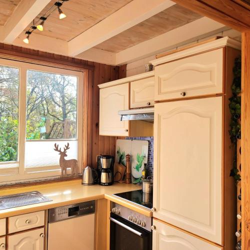 Kuchyň nebo kuchyňský kout v ubytování Hillhouse - Ferienhaus mit Sauna