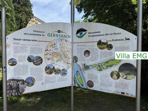 a large sign in the grass with a map at Luxury Spa Villa EMG Karlsruhe Baden-Baden Rastatt - Gernsbach in Gernsbach
