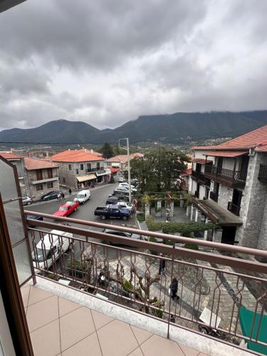 a balcony with a view of a street with cars at Vytina in Vytina