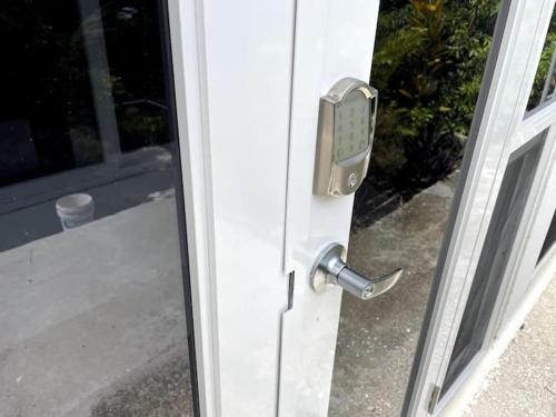 a door with a handle on a door with a window at Spring Valley Vista, Ocean View Apartment Ocho Rios in Tower Isle
