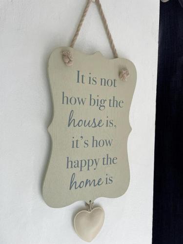 a sign that says it is not how big the house is at Spring Valley Vista, Ocean View Apartment Ocho Rios in Tower Isle