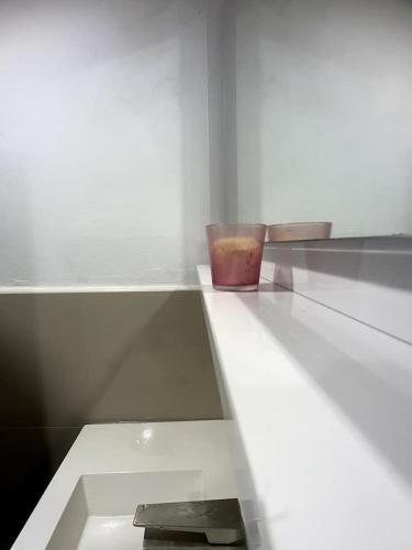 a white counter with a bowl on top of it at Spring Valley Vista, Ocean View Apartment Ocho Rios in Tower Isle