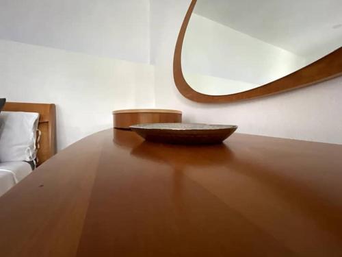 a bowl sitting on top of a wooden table at Spring Valley Vista, Ocean View Apartment Ocho Rios in Tower Isle