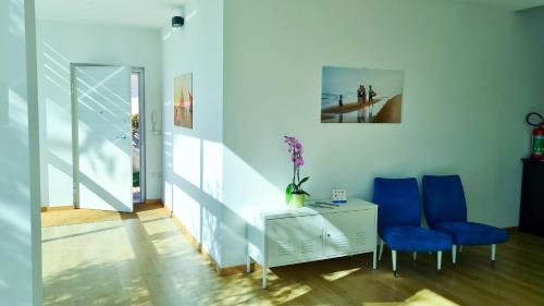 Un lugar para sentarse en Otium casa vacanze-servizio spiaggia incluso a 250 mt-struttura pet friendly