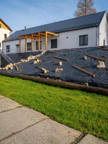 a house with a roof with baseball equipment on it at Chata Zlatnik v Jizerských horách in Zlatá Olešnice