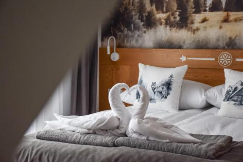 Voodi või voodid majutusasutuse Kaniówka Ski Resort- relaks w górach z basenem, sauną i jacuzzi toas