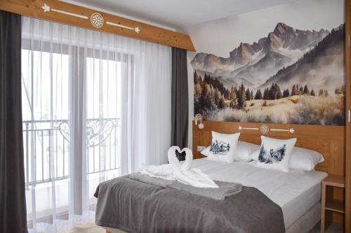 Postel nebo postele na pokoji v ubytování Kaniówka Ski Resort- relaks w górach z basenem, sauną i jacuzzi