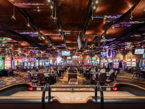 a casino with a lot of tables and televisions at The Riverview in Cape Girardeau