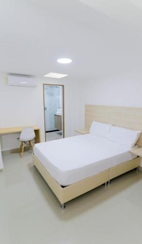 Postel nebo postele na pokoji v ubytování Hotel Pasarela AW