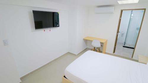 TV a/nebo společenská místnost v ubytování Hotel Pasarela AW