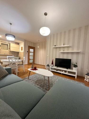 a living room with a couch and a table at Posto Capitano apartment Sasa in Kotor