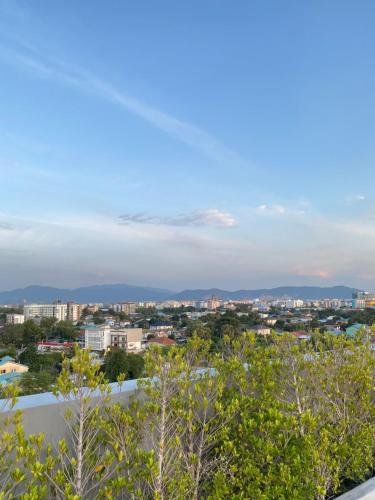 a view of the city from the balcony at Double J Room the east ville Bangsean in Ban Hua Khao Sammuk