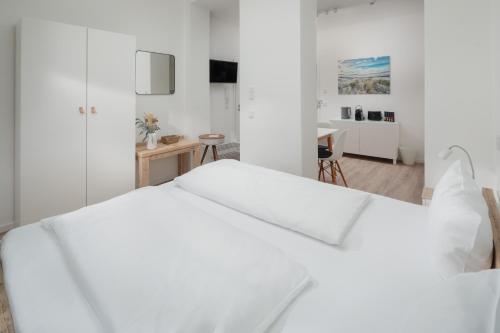 Ένα ή περισσότερα κρεβάτια σε δωμάτιο στο Strandloft VIER Norderney
