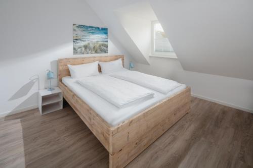 Ένα ή περισσότερα κρεβάτια σε δωμάτιο στο Strandloft VIER Norderney