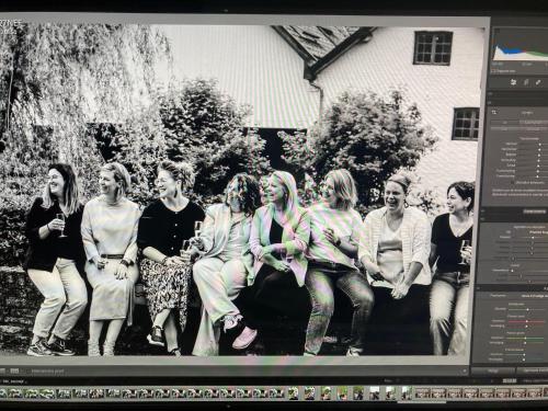 a group of women are sitting on a bench at Vakantiewoning Wurfeldermolen in Maaseik