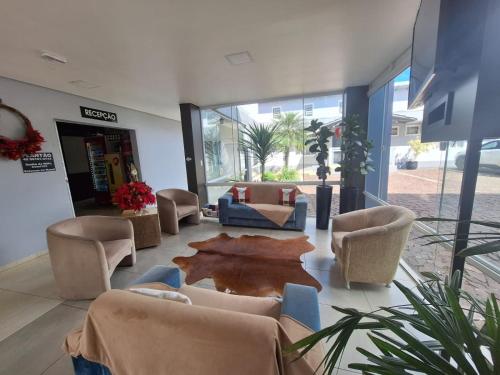 a lobby with couches and chairs in a building at Hotel Descanso in Descanso