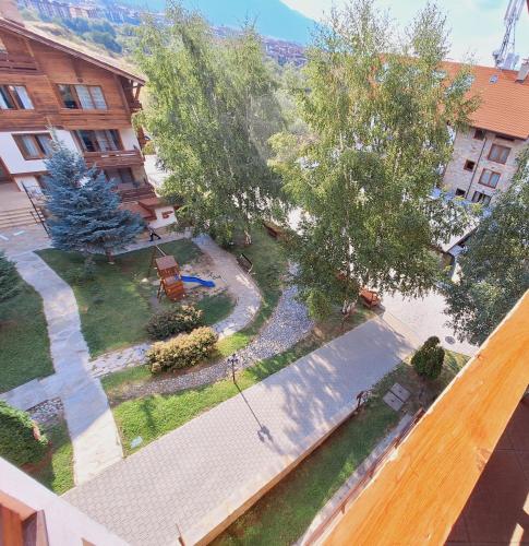 an overhead view of a yard with trees and a building at Slopes View Private Apartment - Luxury SPA in the 4-Star St Ivan Rilski Complex in Bansko