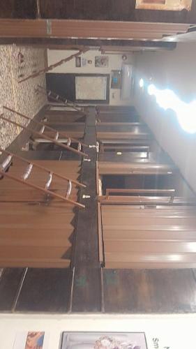 an empty kitchen with wooden cabinets in a room at Petra dorms inn in Petra