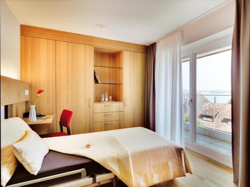 Un pat sau paturi într-o cameră la Ferienhotel Bodensee
