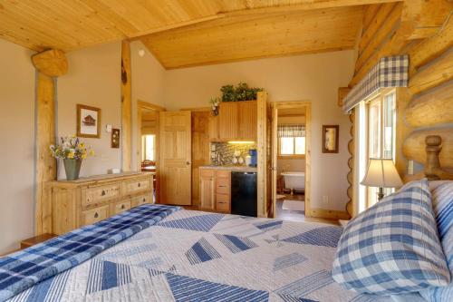 a bedroom with a large bed in a room at 24-0089 Rustic Hartsel Getaway with 35-Acre Yard in Fairplay